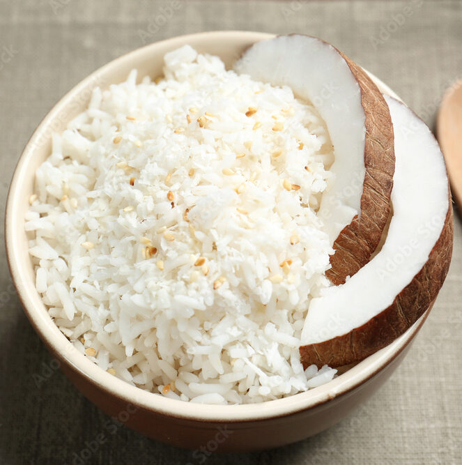 Bowl with coconut rice on table