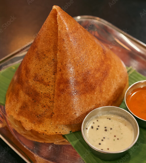 Dosa, ghee roast with coconut chutney sambar popular South Indian Breakfast, Mysore Bangalore Karnataka  Kerala, Tamil Nadu India. Top view of Masala dosa, pancake stuffed with potato curry side dish.