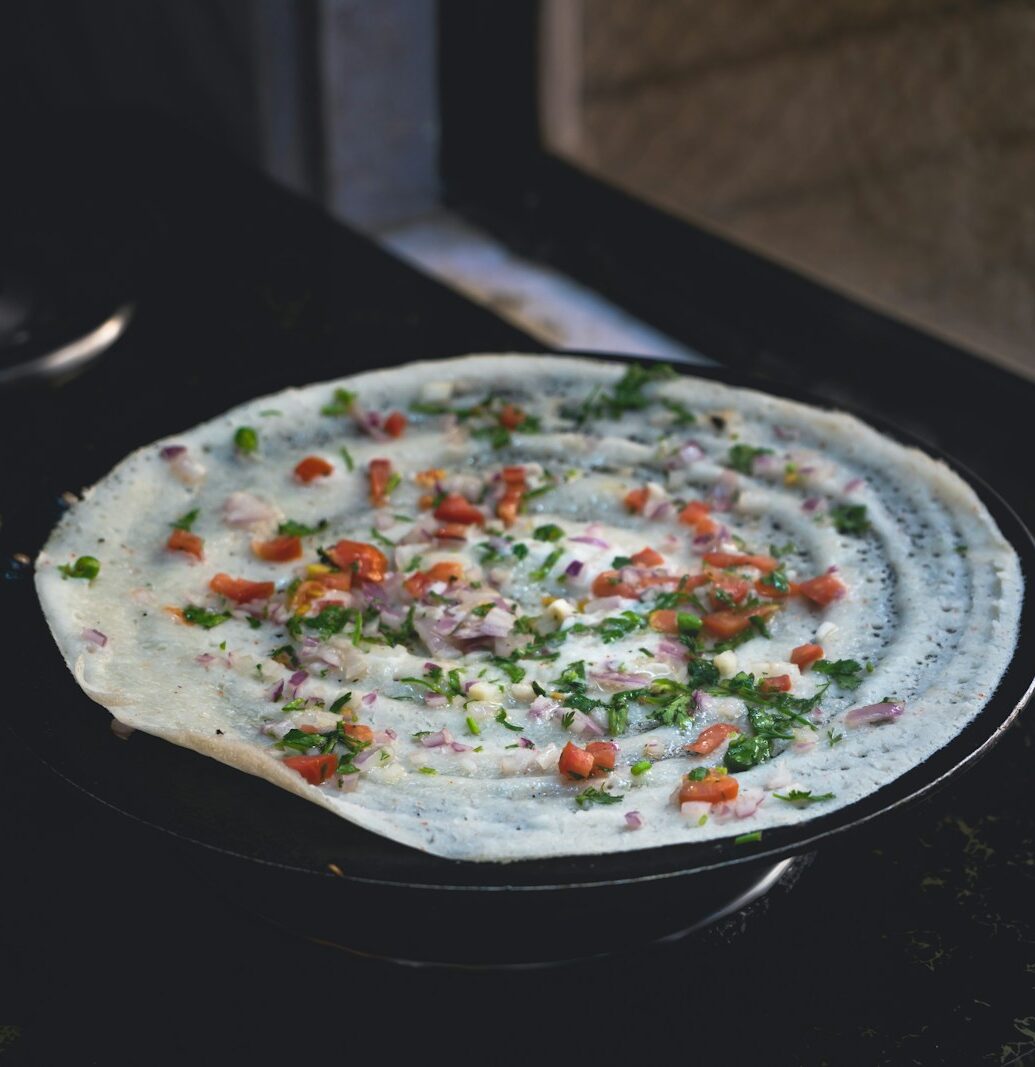 A pizza sitting on top of a stove top oven