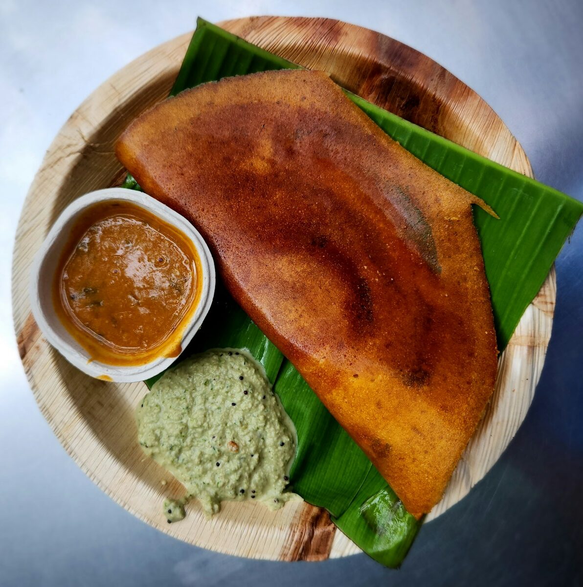 a plate of food on a wooden plate
